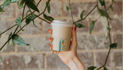 Person holding Little Green Panda Cup